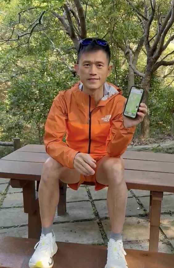 Stone showing WayMe app on his phone