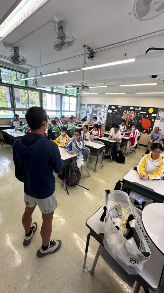 Trail runner Wong Ho Chung presenting in a class room
